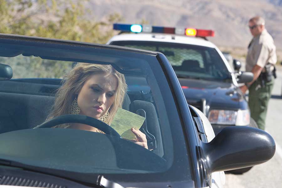 child custody page. image is woman being pulled over